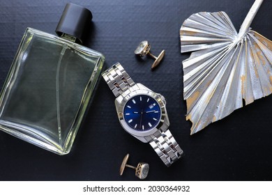 Fashion  Style. Men's Accessories. Mens Watch And Cufflinks Isolated On Black Background 