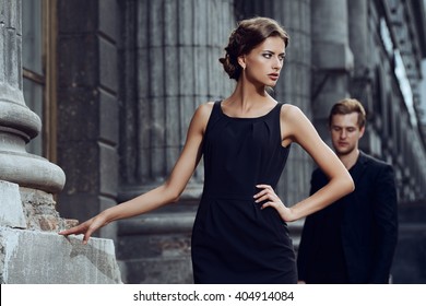 Fashion Style Photo Of A Beautiful Couple Over City Background. 