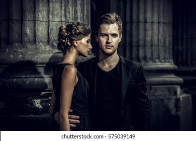 Fashion Style Photo Of A Beautiful Couple Over City Background. 