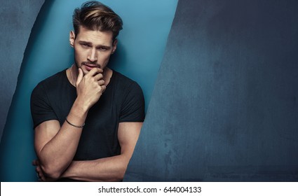 Fashion style portrait of a muscular, handsome guy