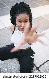 Fashion, Stylish And Woman In The City Street With Urban Designer Clothes From Above. Face Portrait Of A Young, Trendy And Cool African Girl Model With Style, Vision And Creativity In The Road