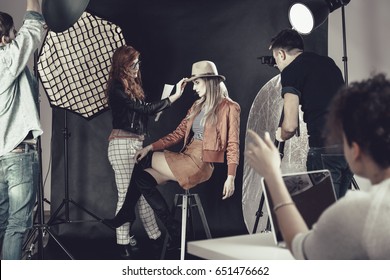 Fashion Stylist With Professional Model At Photoshoot Backstage