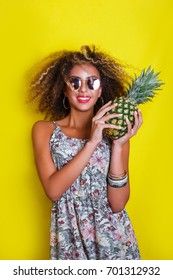 Fashion Summer Portrait Afro American Girl In Sunglasses And Pineapple Over Yellow Background