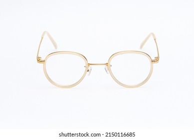 Fashion Sunglasses White And Gold Frames On White Background.