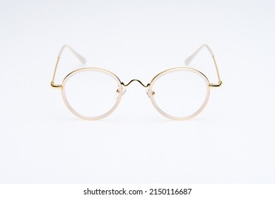 Fashion Sunglasses White And Gold Frames On White Background.