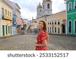 Fashion tourist woman visiting Pelourinho famous historic center of Salvador de Bahia, UNESCO World Heritage, Brazil