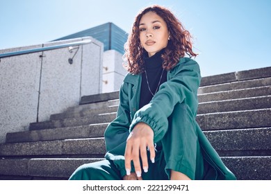 Fashion, travel and woman student on building steps in a city, with vision for mission, goal and mindset. Portrait, girl and exchange student on a solo trip in New York, proud and confident downtown