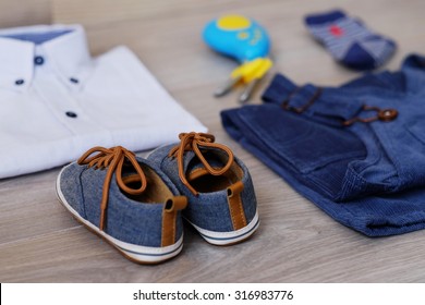 Fashion Trendy Look Of Baby Clothes And Toy On The Wooden Floor. Little Gentleman Boy Apparel Items Set. Cute And Stylish Children Collage.