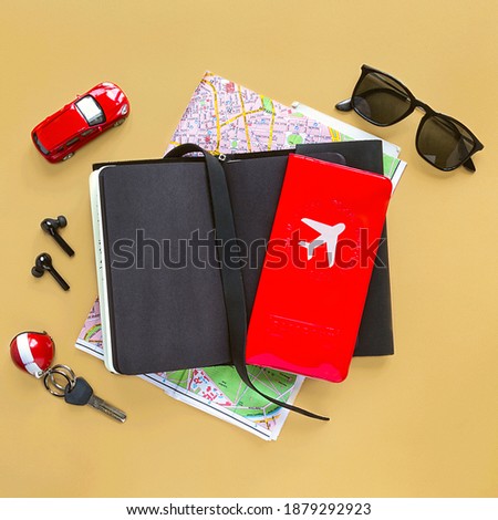 Fashion trevel men accessories and devices on beige background. View from top, Flat lay.