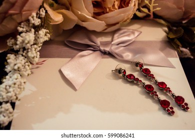 Fashion Wedding Background For Gift Card. Bouquet Of Peonies, Crystal Earrings And Present Jewelry Box.