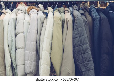 Fashion Winter Coats Hanged On A Clothes Rack.