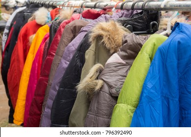 Fashion Winter Coats Hanged On A Clothes Rack.