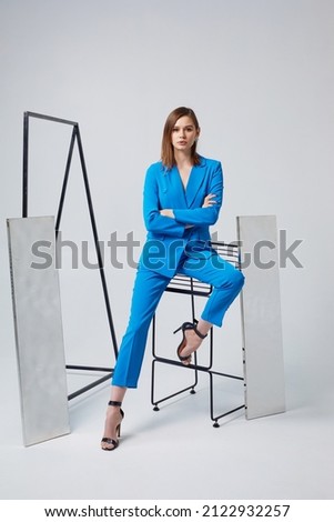 Fashion woman in blue trendy suit. Trendy fashion outfit