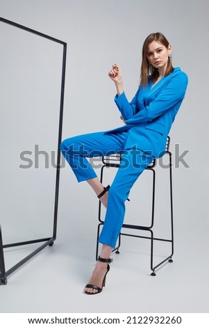 Fashion woman in blue trendy suit. Trendy fashion outfit