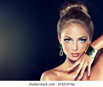 fashion woman with jewelry . girl with the hair ban and fashionable jewelry , earrings ,bracelets