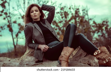 Fashion Woman Outdoor In Autumn Scenery