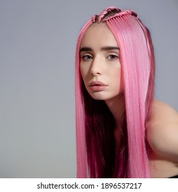 Fashion Woman With Pink Hair. Portrait On A Gray Background. Copycpase