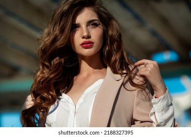 Fashion woman in trendy autumn outfit posing outdoor near see. Vogue style model girl in casual jacket and jeans outdoors. Brunette lady lifestyle portrait. - Shutterstock ID 2188327395