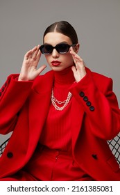 Fashion Woman In Trendy Red Outfit. Total Red Look, Sunglasses, Red Coat, Poloneck, Pants