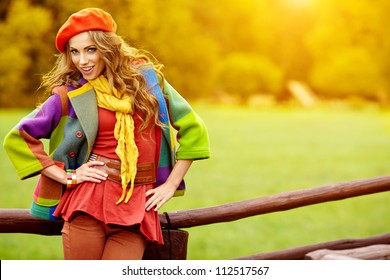 Fashion Woman  Walking In Autumn Park