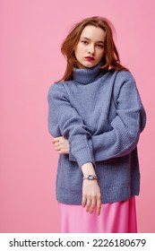 Fashionable beautiful woman wearing trendy knitted blue turtleneck sweater. Studio portrait - Shutterstock ID 2226180679