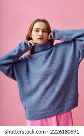 Fashionable beautiful woman wearing trendy knitted blue turtleneck sweater. Studio portrait - Shutterstock ID 2226180691