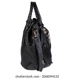 Fashionable Black Leather Purse Or Handbag On White Background. Glossy And Soft Material With Double Carry Straps, Tassel, Gold Studs, Gold Buckle, And Gold Zipper. Side View. 