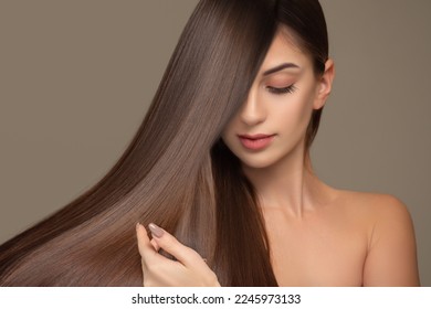 Fashionable brunette woman with straight long shiny hair. beauty and hair care - Shutterstock ID 2245973133
