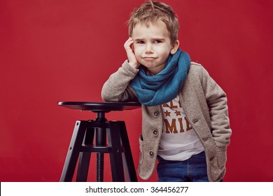 Fashionable child. little boy hairstyle. Autumn fashion.funny smiling kid
