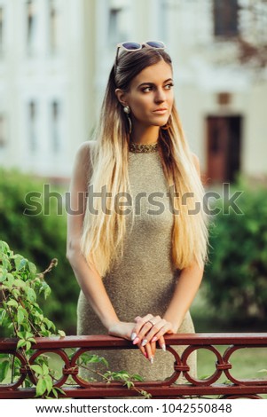 Similar – Image, Stock Photo Smiling young woman in urban background