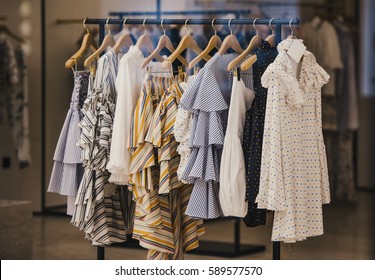 Fashionable clothes in a boutique store in London. - Shutterstock ID 589577570