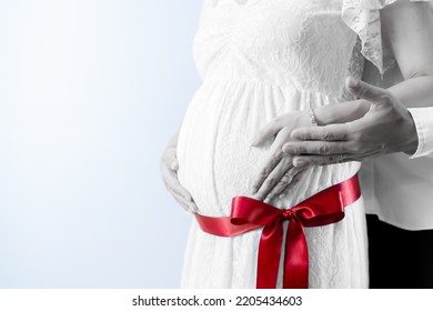 Fashionable Couple Maternity Photo Image With Tied Ribbon White Background  (shooting A Real Pregnant Woman)