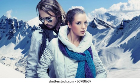 Fashionable Couple Over Alpine Mountains