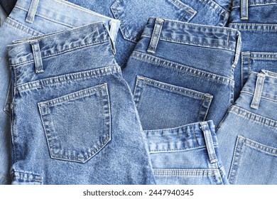 Fashionable denim jeans for teenagers, texture background