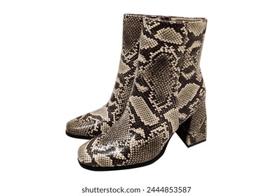 Fashionable footwear boots with python snake leather decorated for women. Stylish footwear with animal print. Footwear with python snake skin print. - Powered by Shutterstock