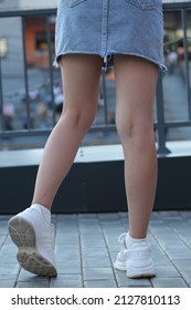 Fashionable Girl In A Denim Skirt