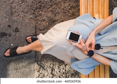 Fashionable girl holding sunglasses and phone mock up