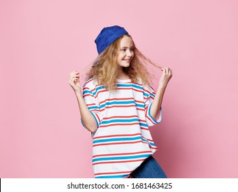Fashionable girl studio lifestyle clothes emotions pink background