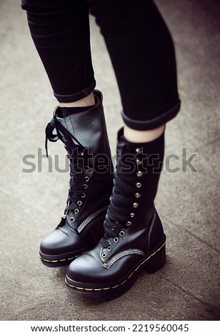 Fashionable gothic leather boots. Shoes concept, fancy unisex stuff