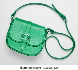 Fashionable Green Leather Bag On A White Background. Top View, Women's Accessories.