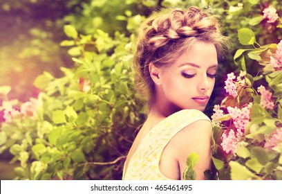 Fashionable Hair Disheveled Braid Around The Head .Happy Beautiful Young Model Girl In Summer Blossom Park.