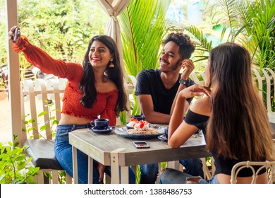 Fashionable Indian Friends Couple Of Two Woman And Man Making Selfie Mobile Phone.friends Long-awaited Meeting Students Eating Pancake Drinking Masala Tea After Shopping.summer Instahram Lifestyle