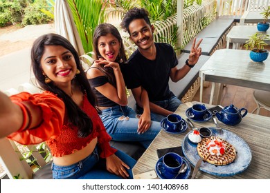 Fashionable Indian Friends Couple Of Two Woman And Man Making Selfie Mobile Phone.friends Long-awaited Meeting Students Eating Pancake Drinking Masala Tea After Shopping.summer Instahram Lifestyle