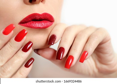 Fashionable Makeup And Manicure In Dark Red And Light Shades Of Nail Polish.Creative Nail Art On A Young Girl On A White Background.