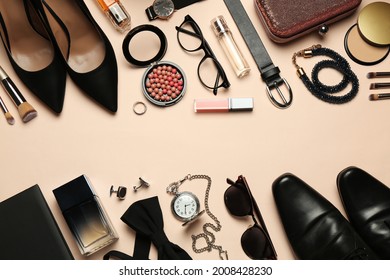 Fashionable male and female accessories on beige background, flat lay. Space for text - Shutterstock ID 2008428230