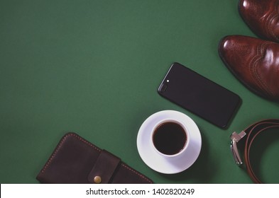 Fashionable Male Flat Lay On A Dark Green Background.