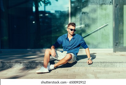 Fashionable Man In A Shirt And Sunglasses. Summer Clothes Season