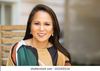 Fashionable Mature Asian Woman Laughing And Smiling.