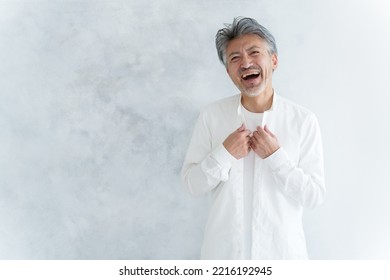 Fashionable Middle Aged Asian Man Dressing Up White Shirt