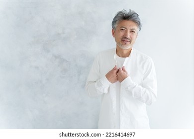 Fashionable Middle Aged Asian Man Dressing Up White Shirt